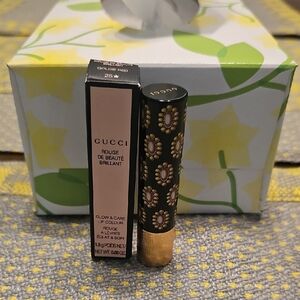 Gucci Gold and Black Lipstick Elegance